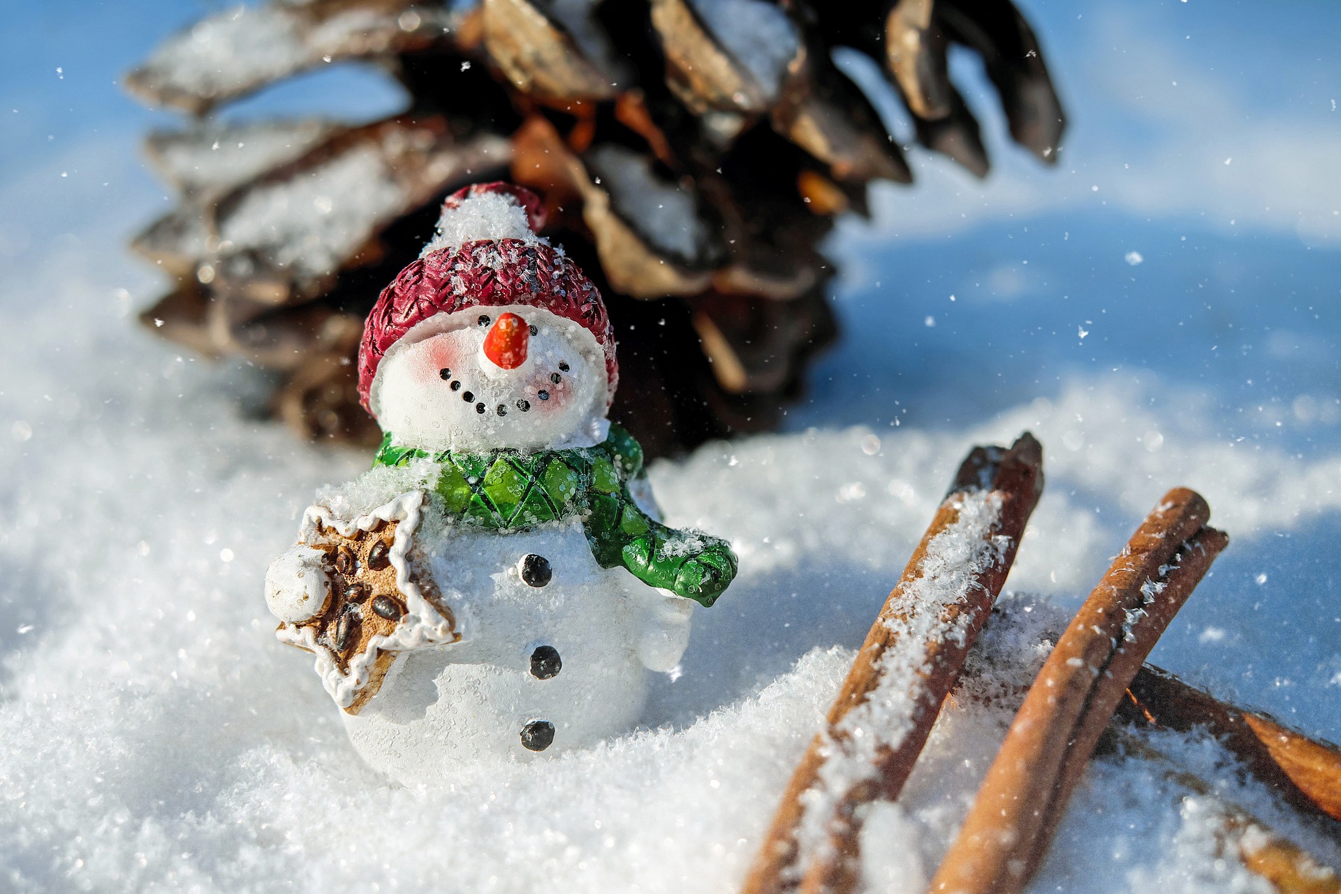 A snowman holding a present