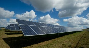 A huge expanse of solar panels on a green field