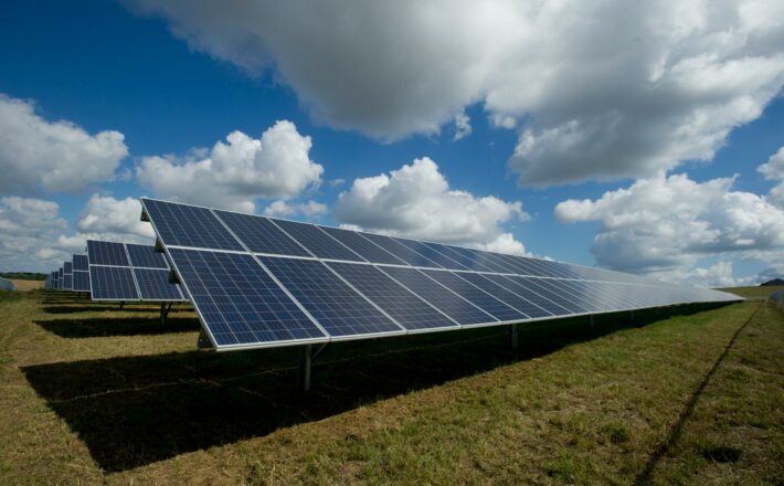 A huge expanse of solar panels on a green field